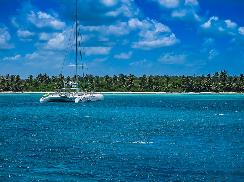 Saona Island, Dominican Republic. Landscape Of A Beautiful Beach With A Catamaran. Travels
