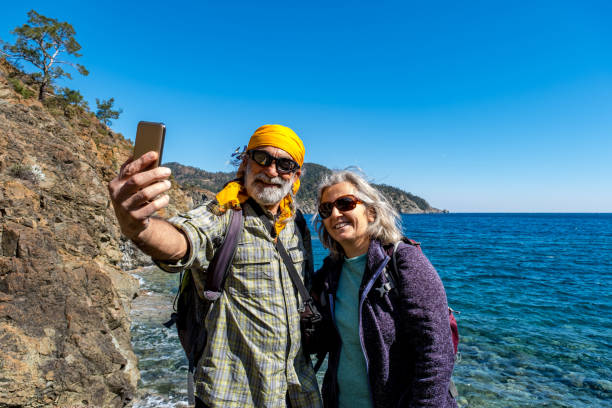 istock Hiker elderly couple taking selfie shots 1303282572