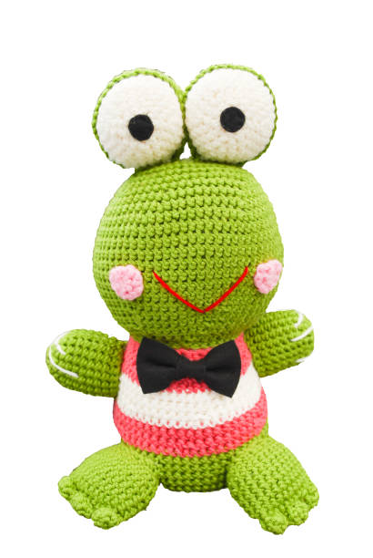 Small lovely green frog toy in crochet handmade on white background isolated and clipping path. stock photo