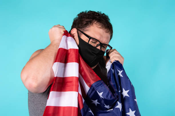 istock Frightened man in a medical mask. 1303283046