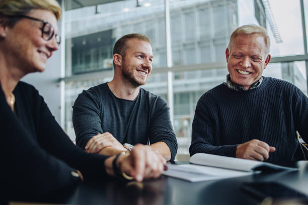 istock Happy business people in a meeting 1303283623
