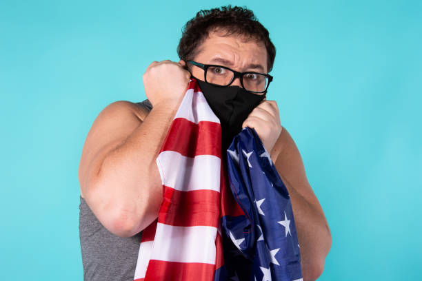 istock Frightened man in a medical mask. 1303283769