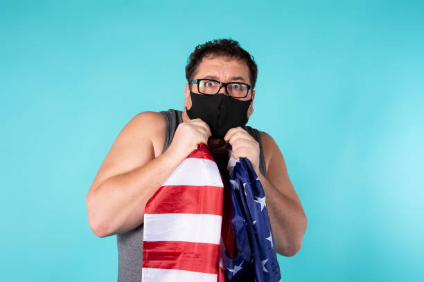 istock Frightened man in a medical mask. 1303283832