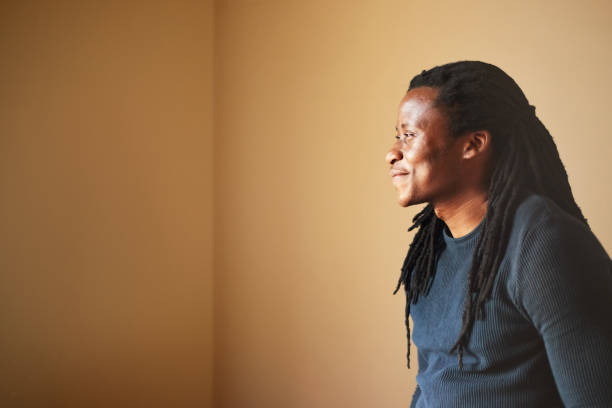 istock Happy african american man looking away 1303284928