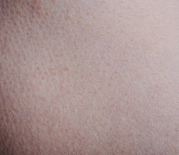 istock Texture of pink human skin 1303284994
