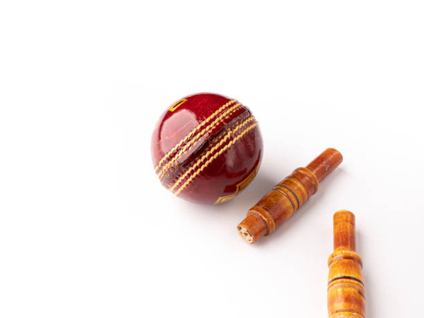 istock Red cricket ball and bells isolated stock image with white background. 1303286852