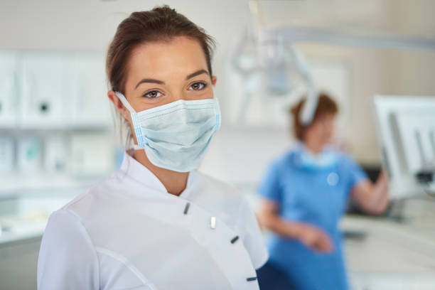 istock dental nurse portrait 1303286916
