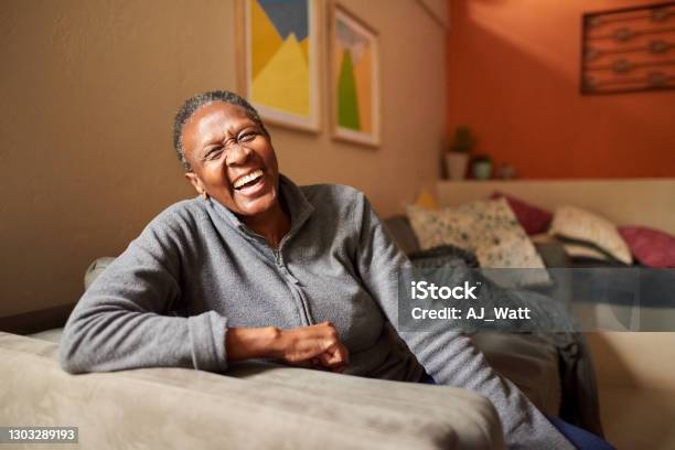 Laughing Senior Woman At Home Stock Photo - Download Image Now - Senior Adult, Happiness, Domestic Life