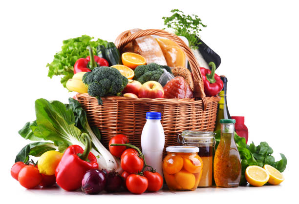 istock Wicker basket with assorted grocery products 1303289600