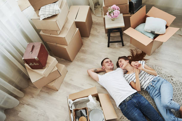 istock Taking a rest. Lying down on the floor. Cheerful young couple in their new apartment. Conception of moving 1303290682