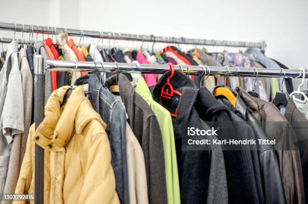 Different Used Clothes For Men And Women On A Rack In A Second Hand Shop Or Thrift Store Stock Photo - Download Image Now