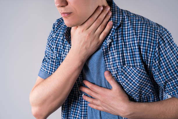 sore throat, men with pain in neck on gray background - surprise color image gasping the human body imagens e fotografias de stock