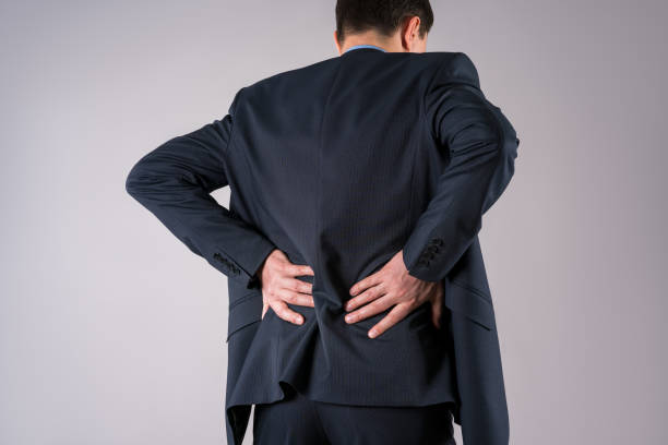istock Back pain, kidney inflammation, office worker diseases on gray background 1303293864