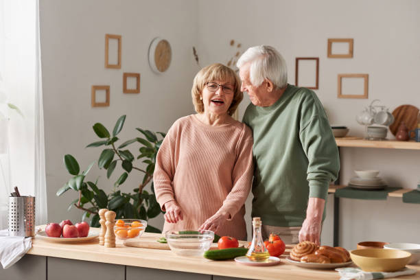 istock Happy senior couple in the kitchen 1303297728