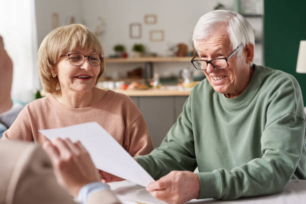 istock Senior couple signing a contract 1303297764