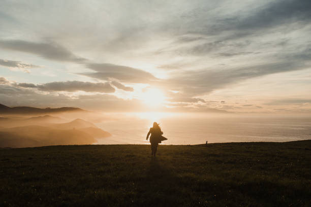 istock Young woman having fun by the sea 1303299207
