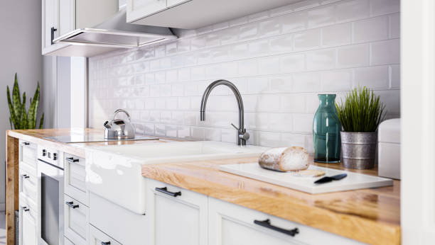 istock Scandinavian open style kitchen in white color, white tiles 1303299225