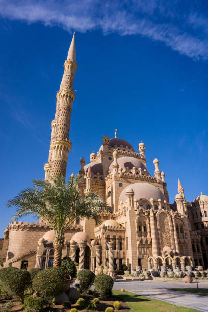 istock Beautiful large Islamic mosque at the sky background 1303300392