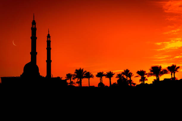 istock Beautiful large Islamic mosque at the sunset sky background 1303301313