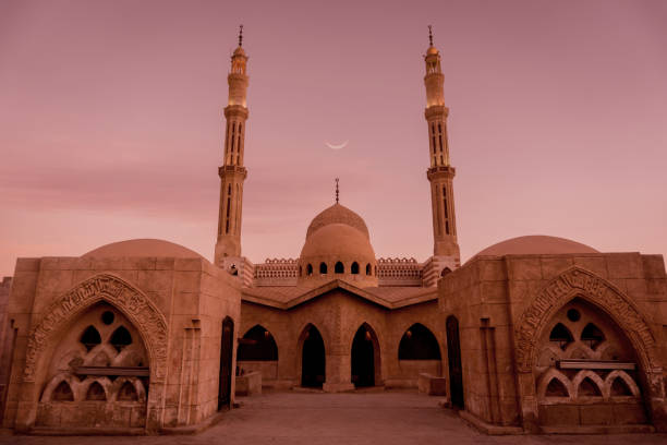 istock Beautiful large Islamic mosque at the sunset sky background 1303301673