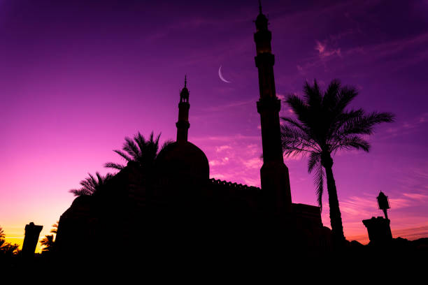 istock Beautiful large Islamic mosque at the sunset sky background 1303301705