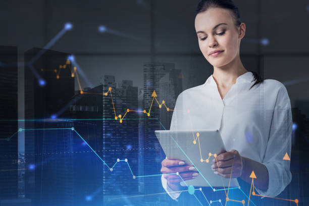istock Woman with tablet and graphs 1303302468