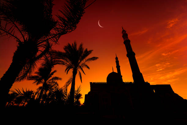 istock Beautiful large Islamic mosque at the sunset sky background 1303302550