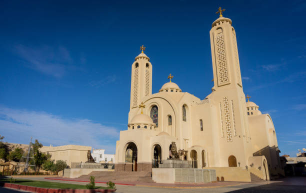 istock Public cathedral coptic egyptian church at the sky background 1303303322