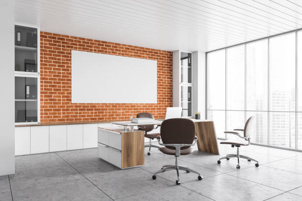 istock Mockup canvas in brick office lobby room with laptop, chairs and table 1303303620