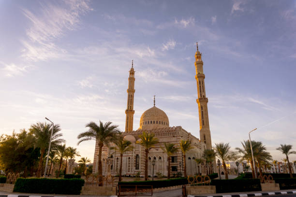 istock Beautiful large Islamic mosque at the sky background 1303303646
