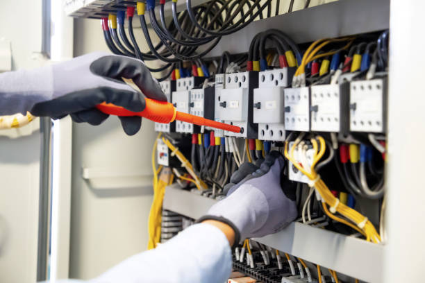 istock Electricians work to connect electric wires in the system. 1303304629