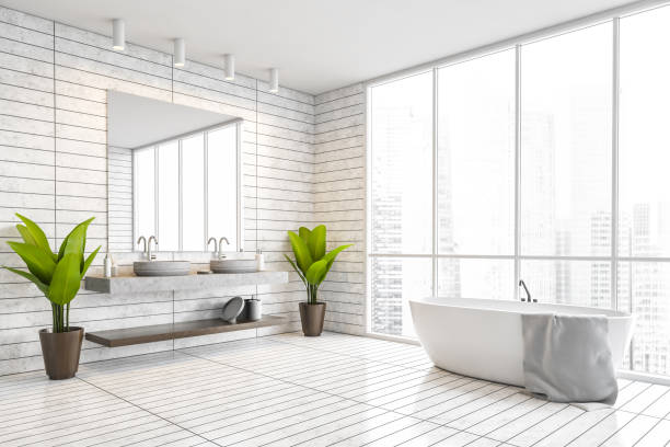 istock Panoramic white tile bathroom corner with tub and sink 1303304981