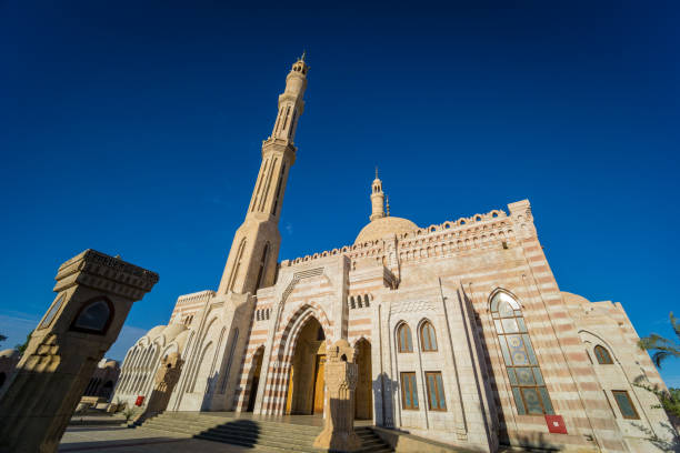 istock Beautiful large Islamic mosque at the sky background 1303305688