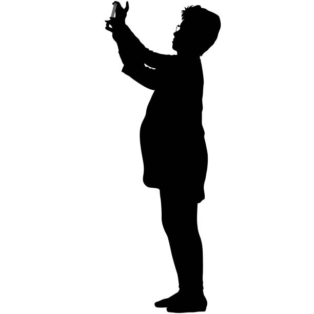 istock Silhouettes woman taking selfie with smartphone on white background 1303305929