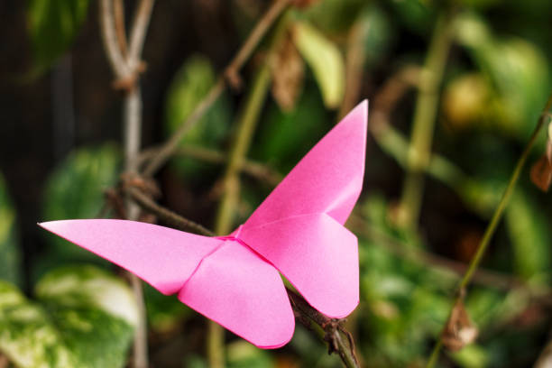 istock Pink origami butterfly 1303306746