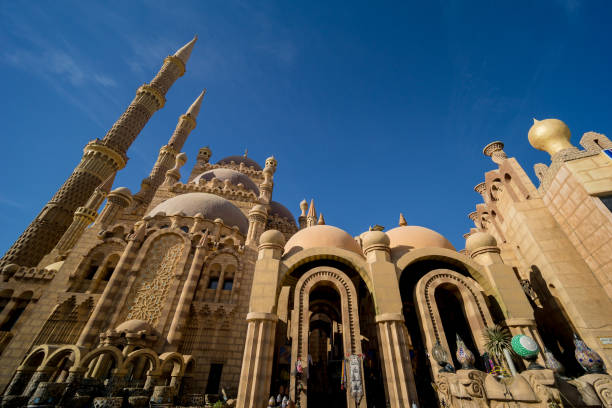 istock Beautiful large Islamic mosque at the sky background 1303306799