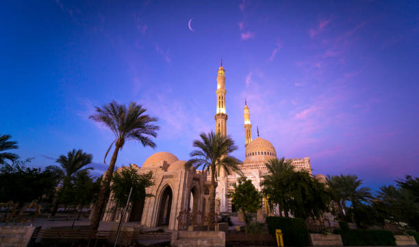 istock Beautiful large Islamic mosque at the sunset sky background 1303307137
