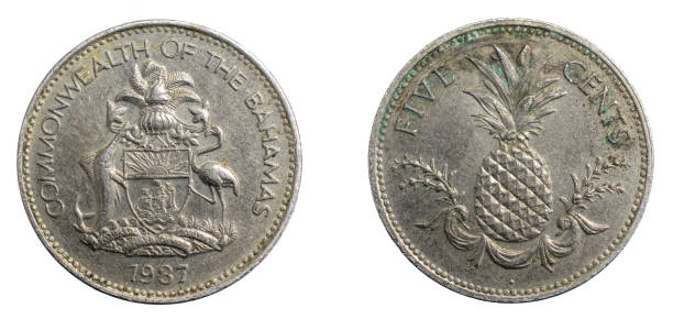 istock Bahamas five cents coin on white isolated background 1303311255