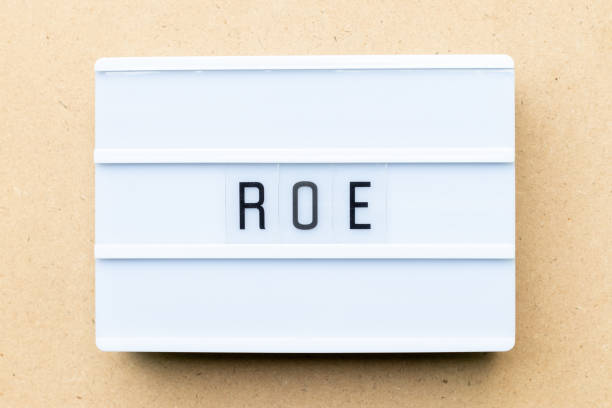 istock White lightbox with word ROE (Abbreviation of Return on equity) on wood background 1303312279