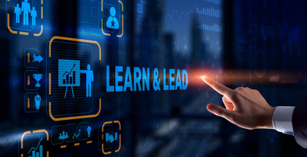 istock Learn and Lead. Businessman presses hand on the virtual screen inscription 1303313525