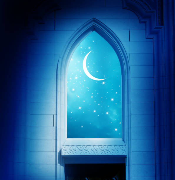 istock Ramadan Kareem background..Mosque window with shiny crescen 1303314171