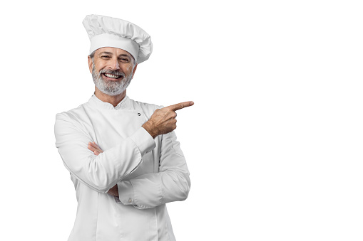 Portait of Master chef pointing on copy space
