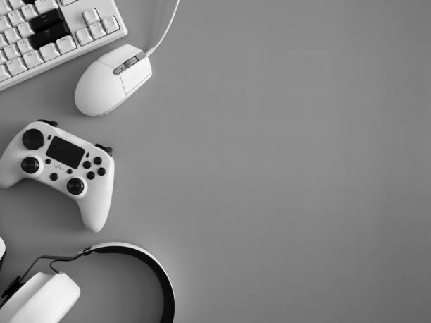 istock gamer work space concept, top view a gaming gear, mouse, keyboard, joystick and headset. 1303316789