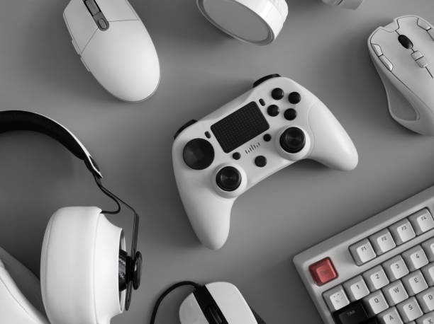 istock gamer work space concept, top view a gaming gear, mouse, keyboard, joystick and headset. 1303316792