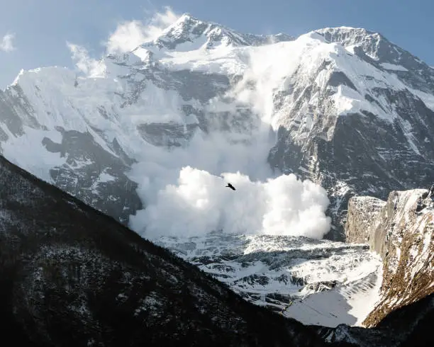 Snow avalanche on Annapurna II mountain slope, Upper Pisang, Annapurna Circuit, Nepal