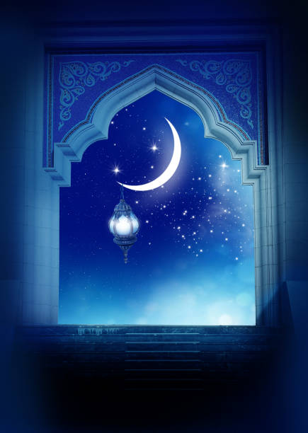 istock Ramadan Kareem background..Mosque window with shiny crescen 1303317366