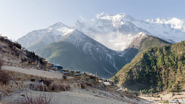 istock Upper Pisang village and Annapurna 2 mountain peak 1303318182