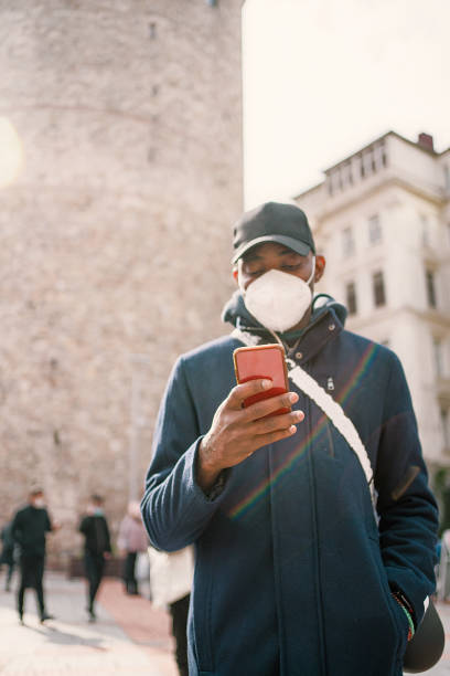 istock man using mobile phone in front of the galata 1303318384