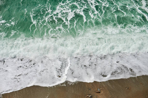 High angle view of coastline and blue waves in Spain during spring