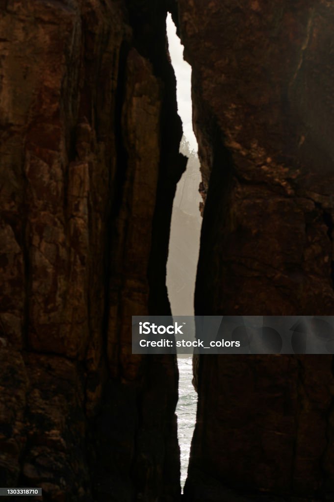 Space between two big rocks Vertical shot of space between two rocks in Spanish landscape Rock - Object Stock Photo